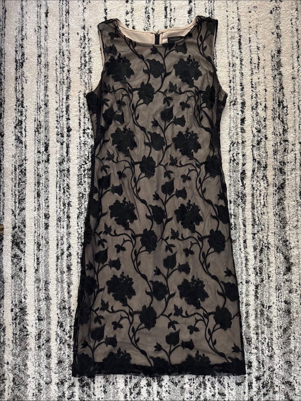 Donna Karan black floral appliqué dress featuring a nude lining